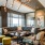 rooftop lounge with floor-to-ceiling windows and downtown views