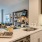 open kitchen counter with sink looking across living room